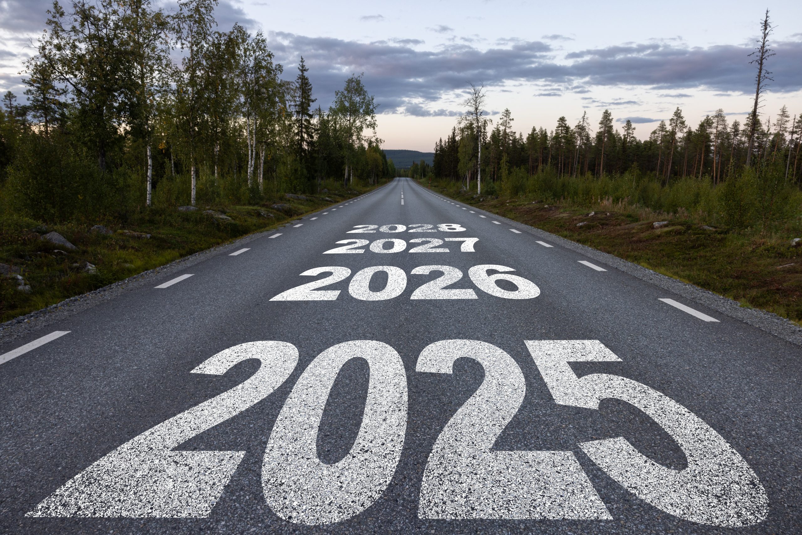 A road with 2025 marked at the start in large print and smaller prints of 2026 and 2027