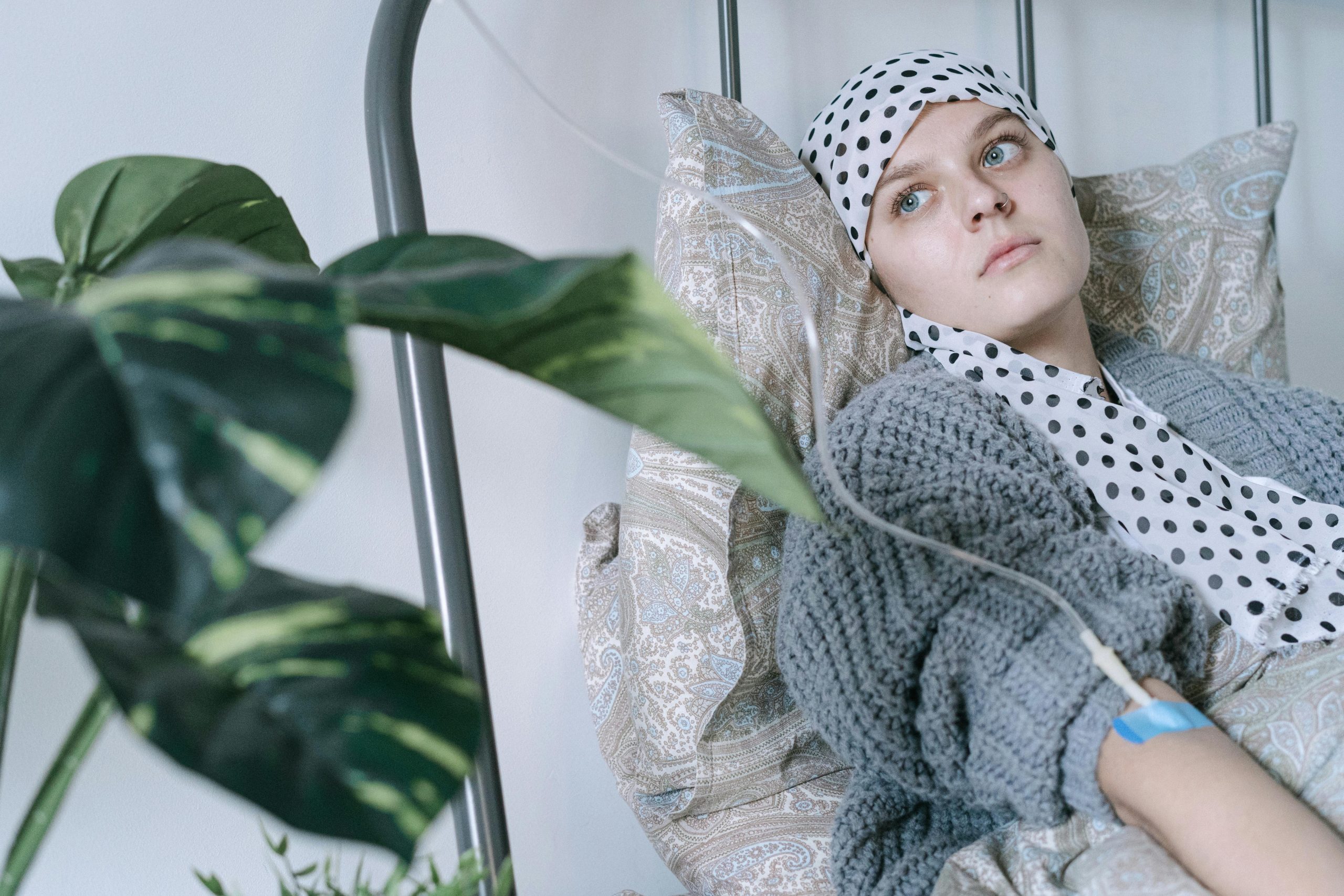 Woman resting during cancer treatment with an IV line